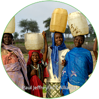 group with water jugs on their heads