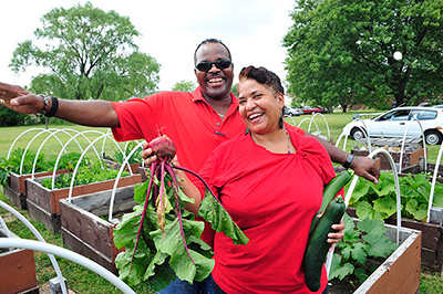 Members of Faith Jubilee Community Church harvesting vegetables