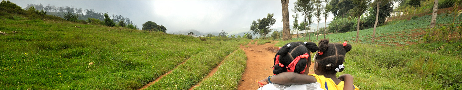 two girls walking down road arm in arm